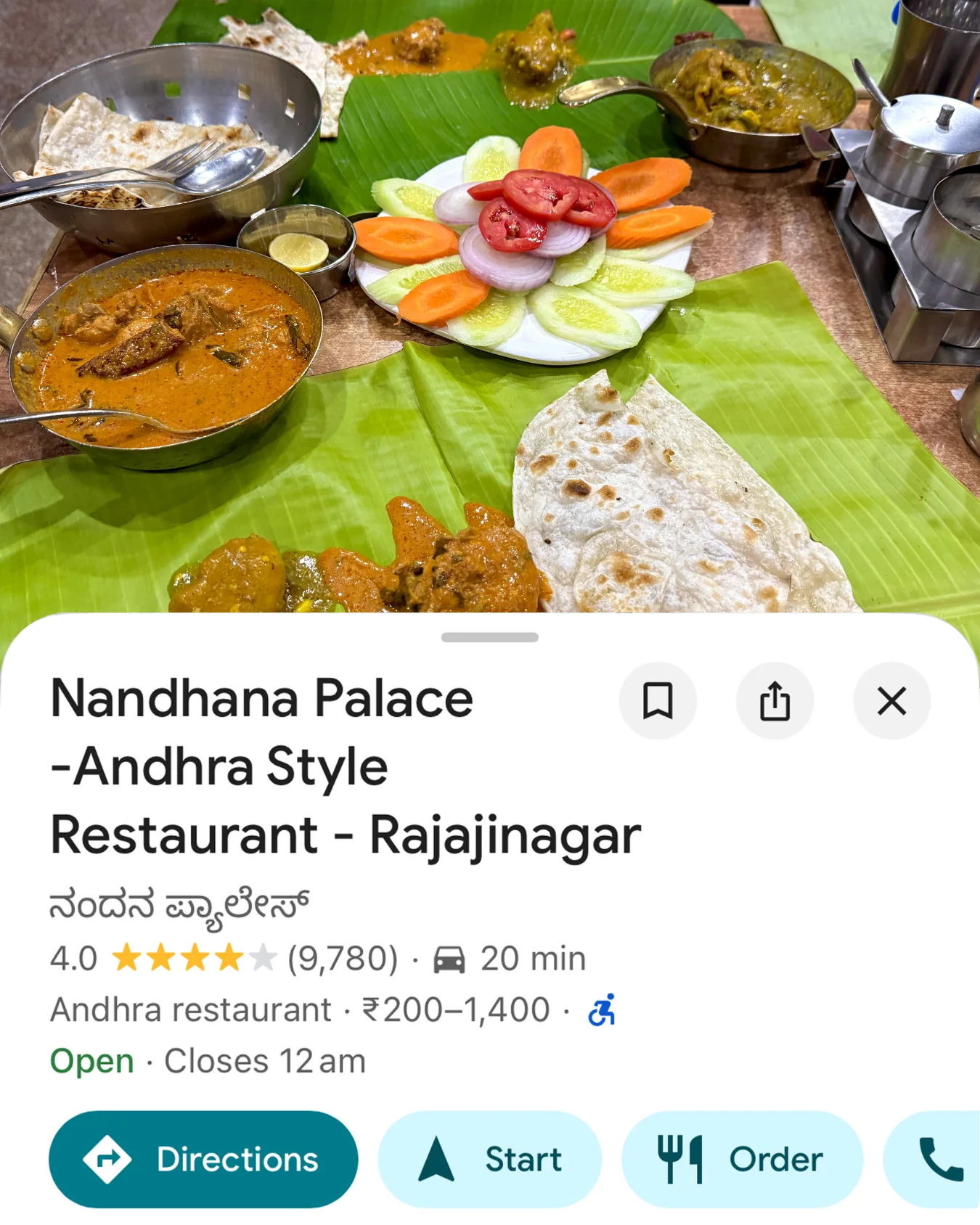 Card for Nandhana Palace in Rajajinagar — an Andhra meal served across a banana leaf.